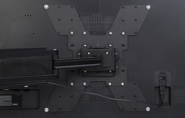 VESA plate mounted behind a TV VESA plate mounted behind a TV